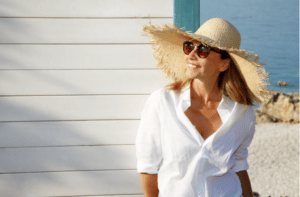 Close up portrait of smiling female by the sea.